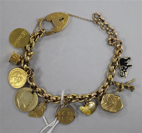 A 9ct gold charm bracelet hung with ten assorted charms,